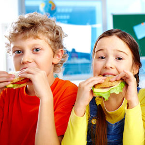 Kids eating sandwiches